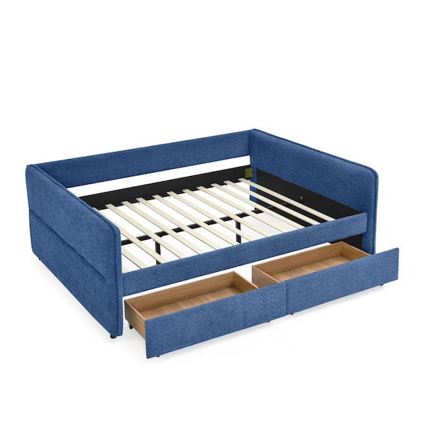 Blue fabric daybed with slatted base and storage drawers on white background.