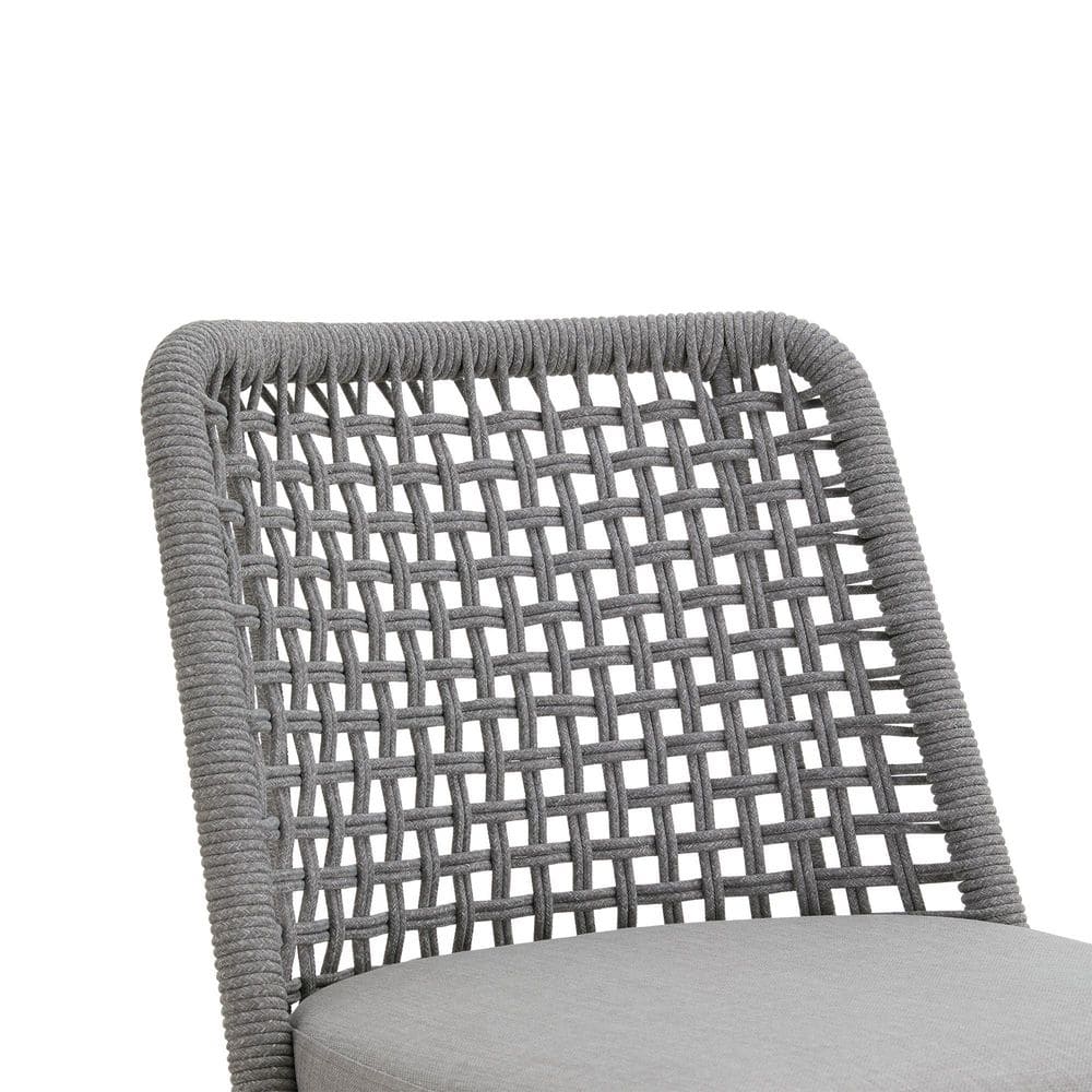 Close-up of the woven rope backrest and cushion of a light gray outdoor dining chair.