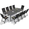 Black outdoor patio dining set with table and chairs on a patio.