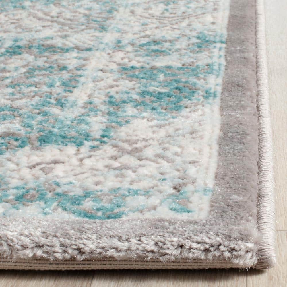 Elysian Ivory & Turquoise 9' x 12' Synthetic Reversible Area Rug