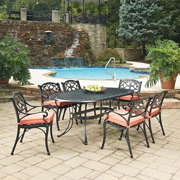 HOMESTYLES Sanibel Black 7-Piece Cast Aluminum Oval Outdoor Dining Set with Orange Coral Cushions