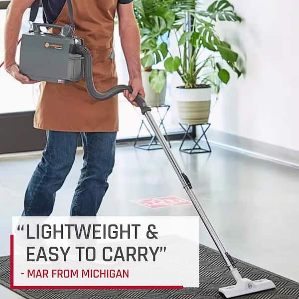 How to carry a canister vacuum upstairs safely