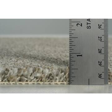 TrafficMaster Caspiana Fiesta Tan 12 ft. Wide x Cut to Length 45 oz. SD Polyester Texture Carpet 52549
