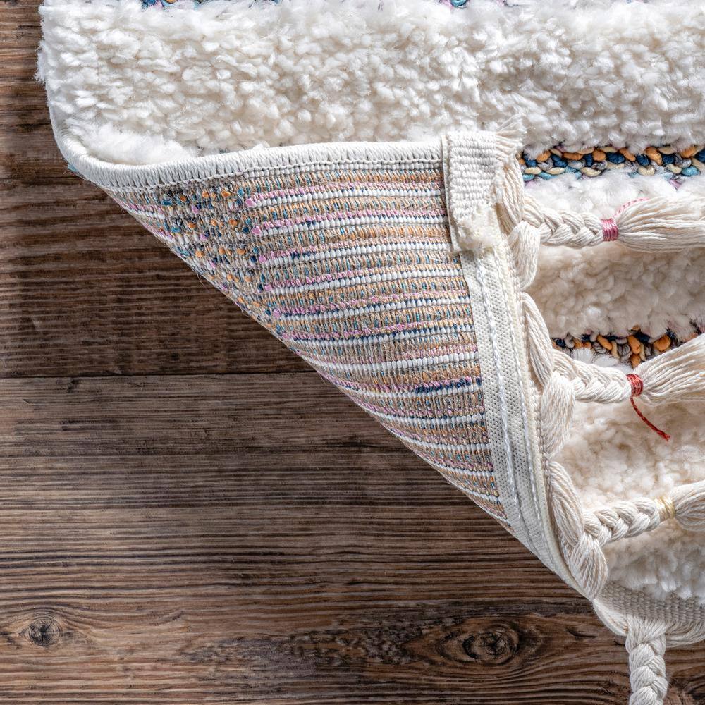 Ivory Geometric Synthetic Rectangular Area Rug with Braided Tassels