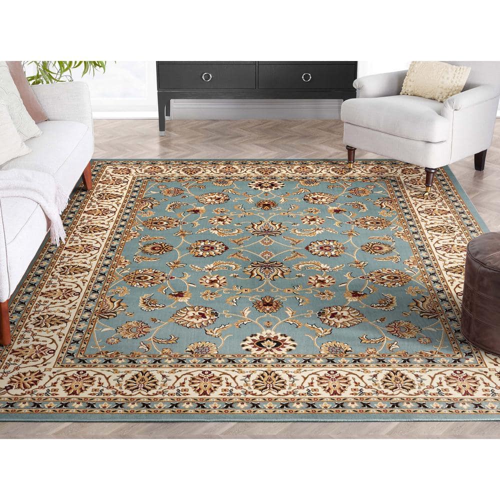 Light Blue and Ivory Synthetic Oriental Area Rug 5'3" x 7'3"