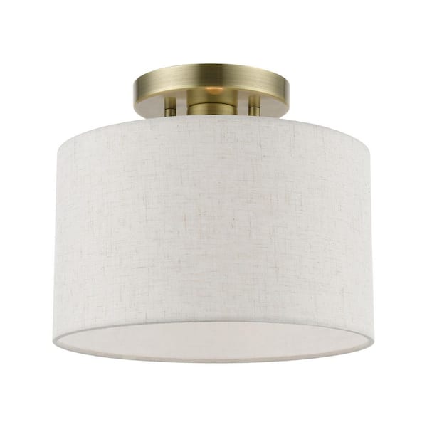 AVIANCE LIGHTING Whitney 10 in. 1-Light Antique Brass Small Semi-Flush Mount with Oatmeal Color Fabric Shade
