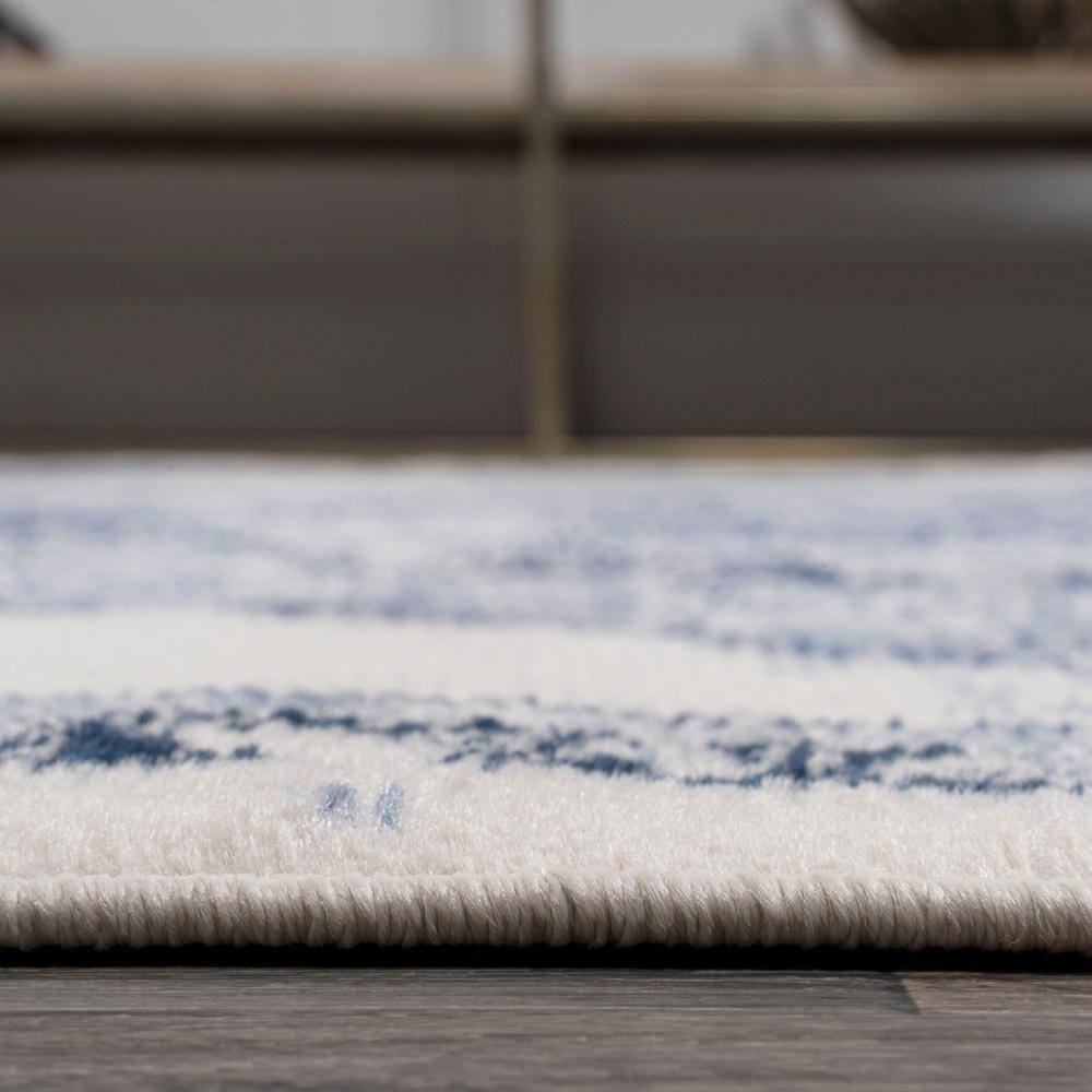 Light Blue and Ivory Synthetic Flat Woven 8' x 10' Area Rug