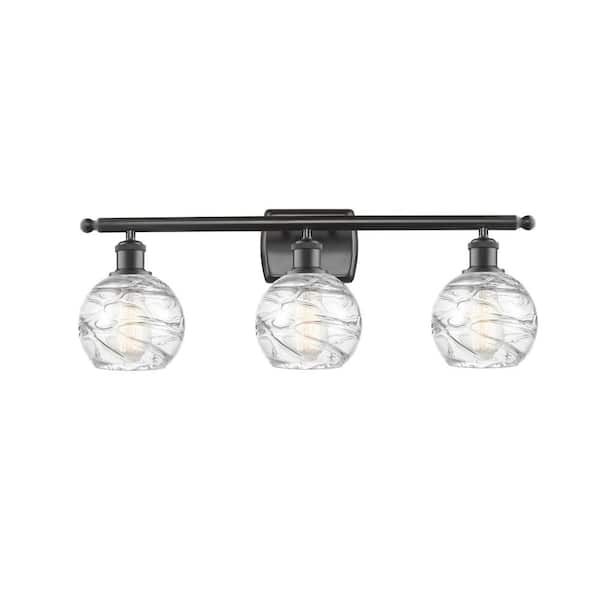 Innovations Athens Deco Swirl 26 in. 3-Light Oil Rubbed Bronze Vanity Light with Clear Deco Swirl Glass Shade