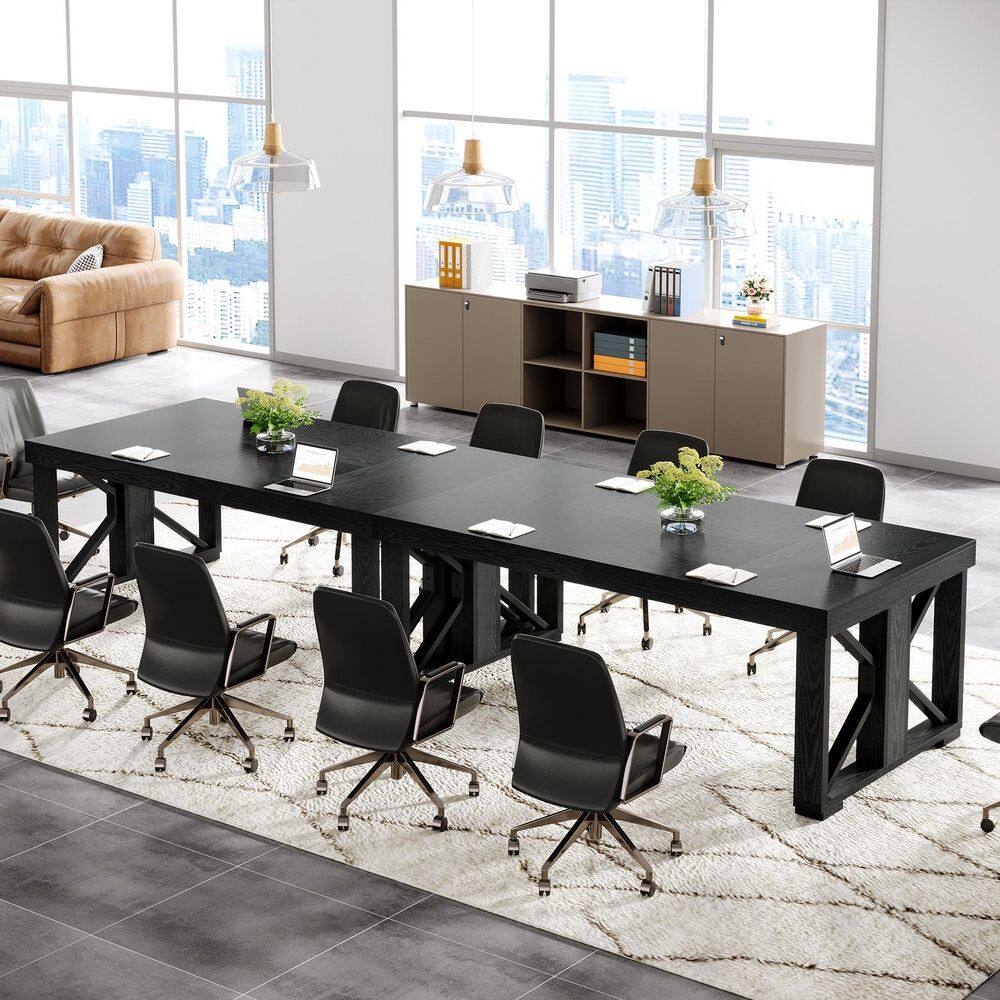 Large conference table in a bright office with modern furniture.