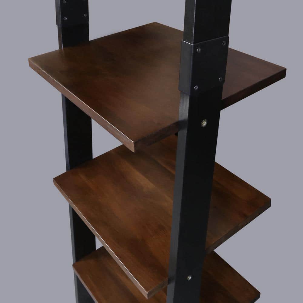 Detailed view of the shelf attachment on the black and walnut ladder bookcase.