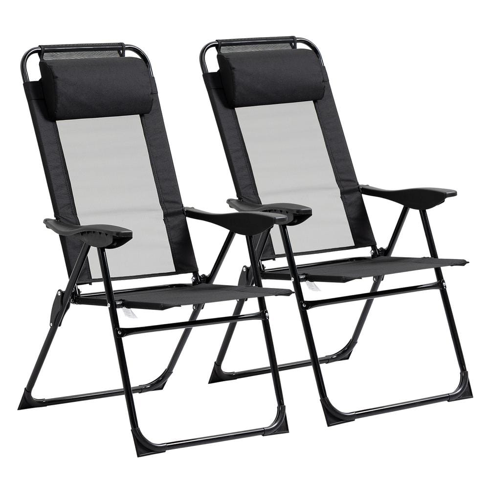 A pair of black folding outdoor chaise lounge chairs against a white background.