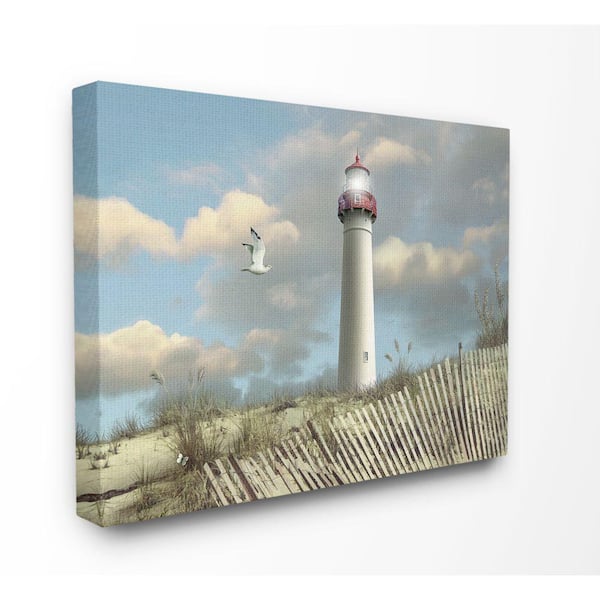Stupell Industries 36 in. x 48 in. "Cape May Sand Dune Fence Lighthouse Beach Scene with Seagull " by Alan Giana & Company Canvas Wall Art