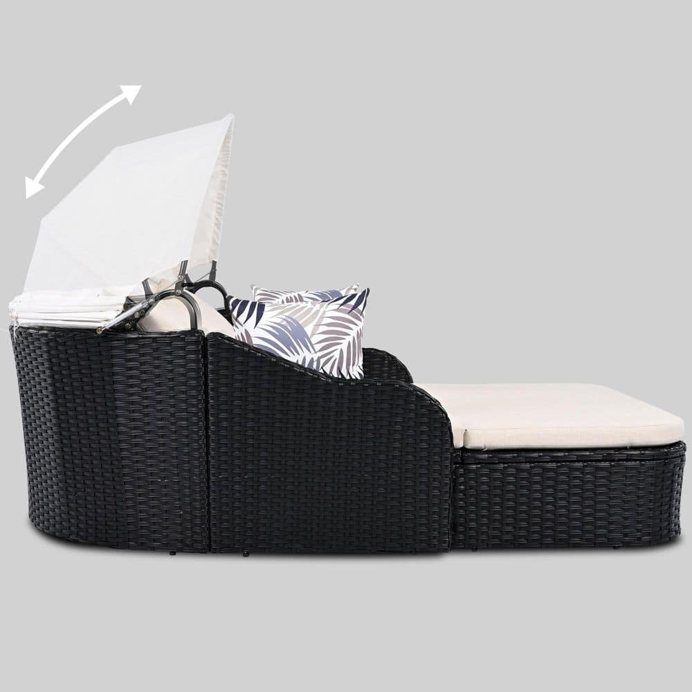 Side view of the black wicker sunbed demonstrating the adjustable white canopy.