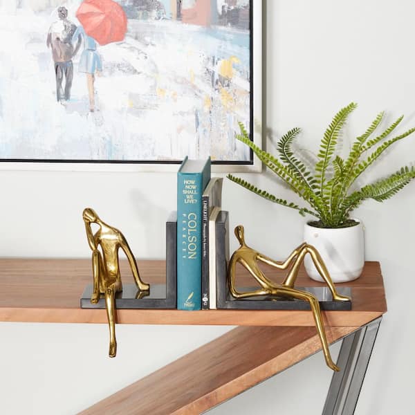 Litton Lane Gold Aluminum Sitting People Bookends (Set of 2)