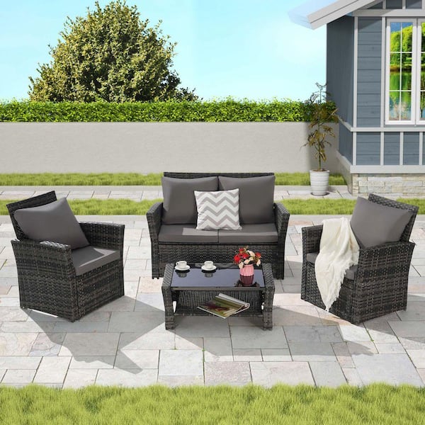 4-Piece Gray Wicker Outdoor Patio Conversation Set with Dark Gray Cushions and Tempered Glass Coffee Table