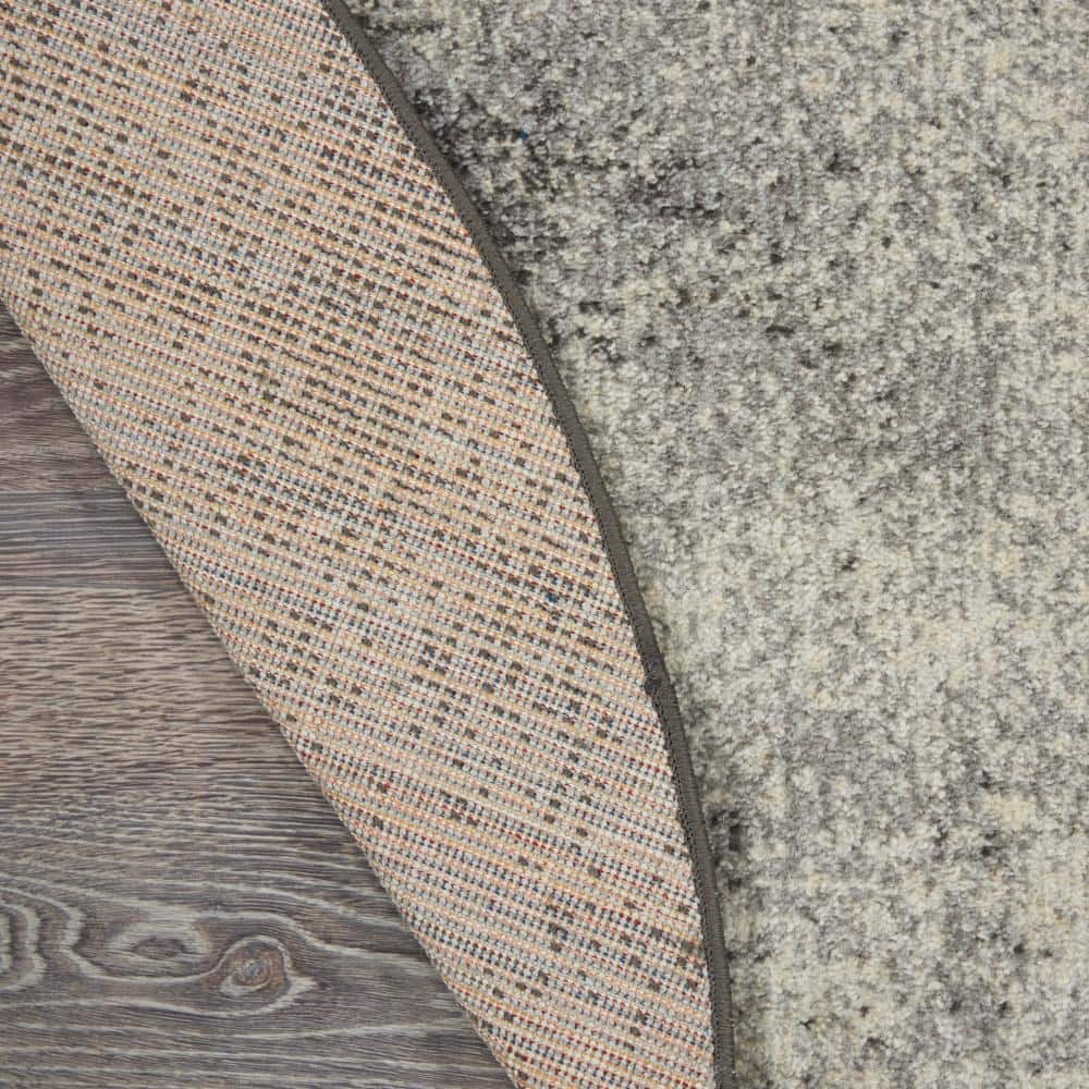 Large Round Gray and Ivory Synthetic Traditional Rug