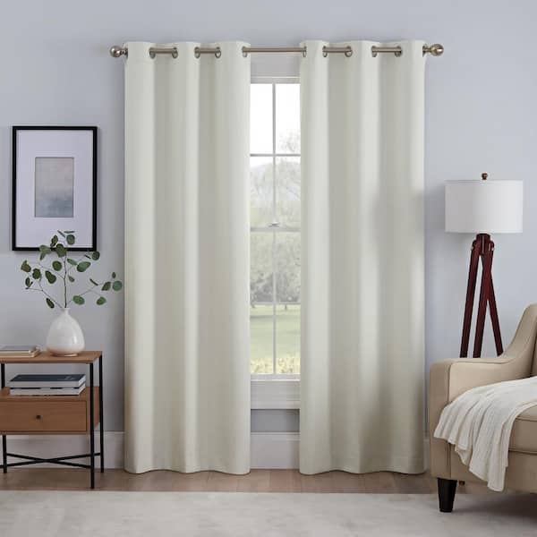 Eclipse Kylie Thermaback Ivory Solid Polyester 37 in. W x 84 in. L 100% Blackout Pair Grommet Top Curtain Panel