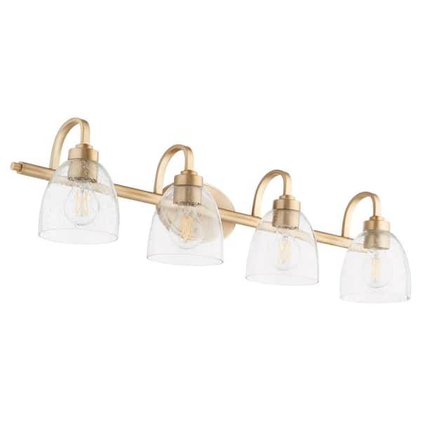Quorum INTERNATIONAL Reyes 4-Light - 100-Watts, Medium Lamp Base Light Vanity 7 in. Width with 4-Clear Glass Diffusers - Aged Brass