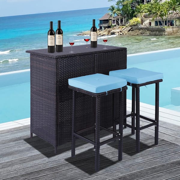 Zeus & Ruta 3-Piece Brown Wicker Outdoor Bar Stool, 1 Table and 2 Stools, with Blue Cushions for Porch, Gardens, Poolside