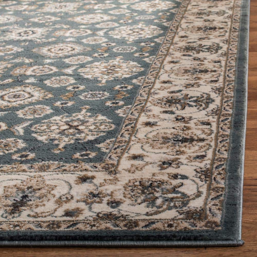 Teal and Cream 9' x 12' Floral Synthetic Area Rug