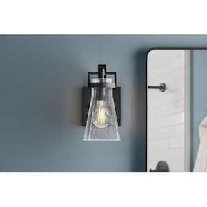 Clermont 5 in. 1-Light Matte Black Bathroom Vanity Light Sconce with Seeded Glass Shade