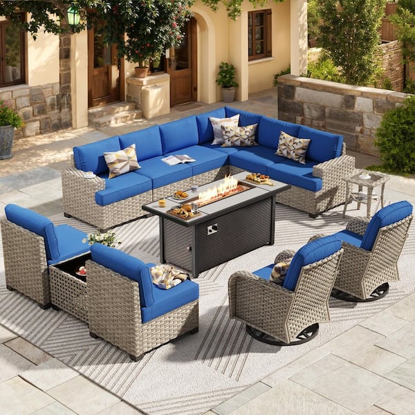 Reverie 13 Pieces Wicker Outdoor Patio Rectangular Fire Pit Set and Swivel Rocking Chairs with Navy Blue Cushions