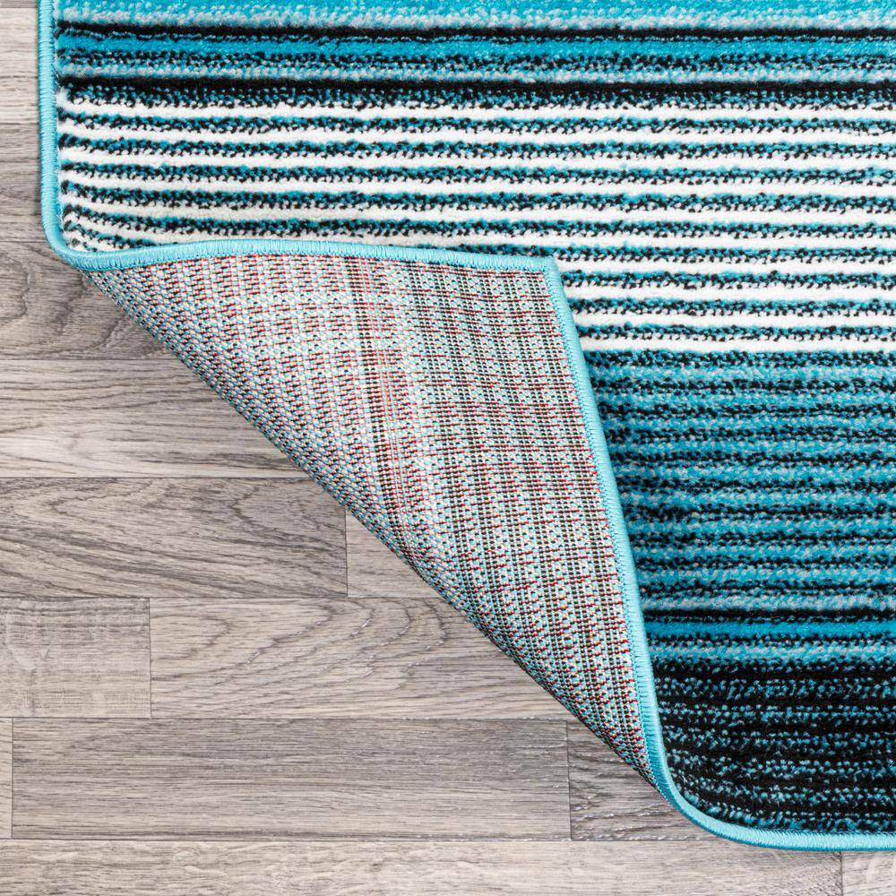 5' x 8' Blue and Navy Gradient Striped Synthetic Area Rug