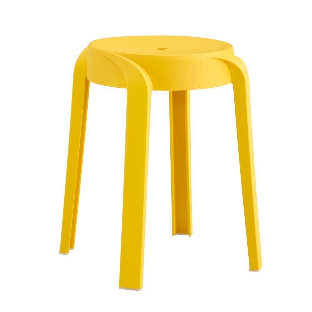 A single mustard yellow plastic stack stool on a white background.