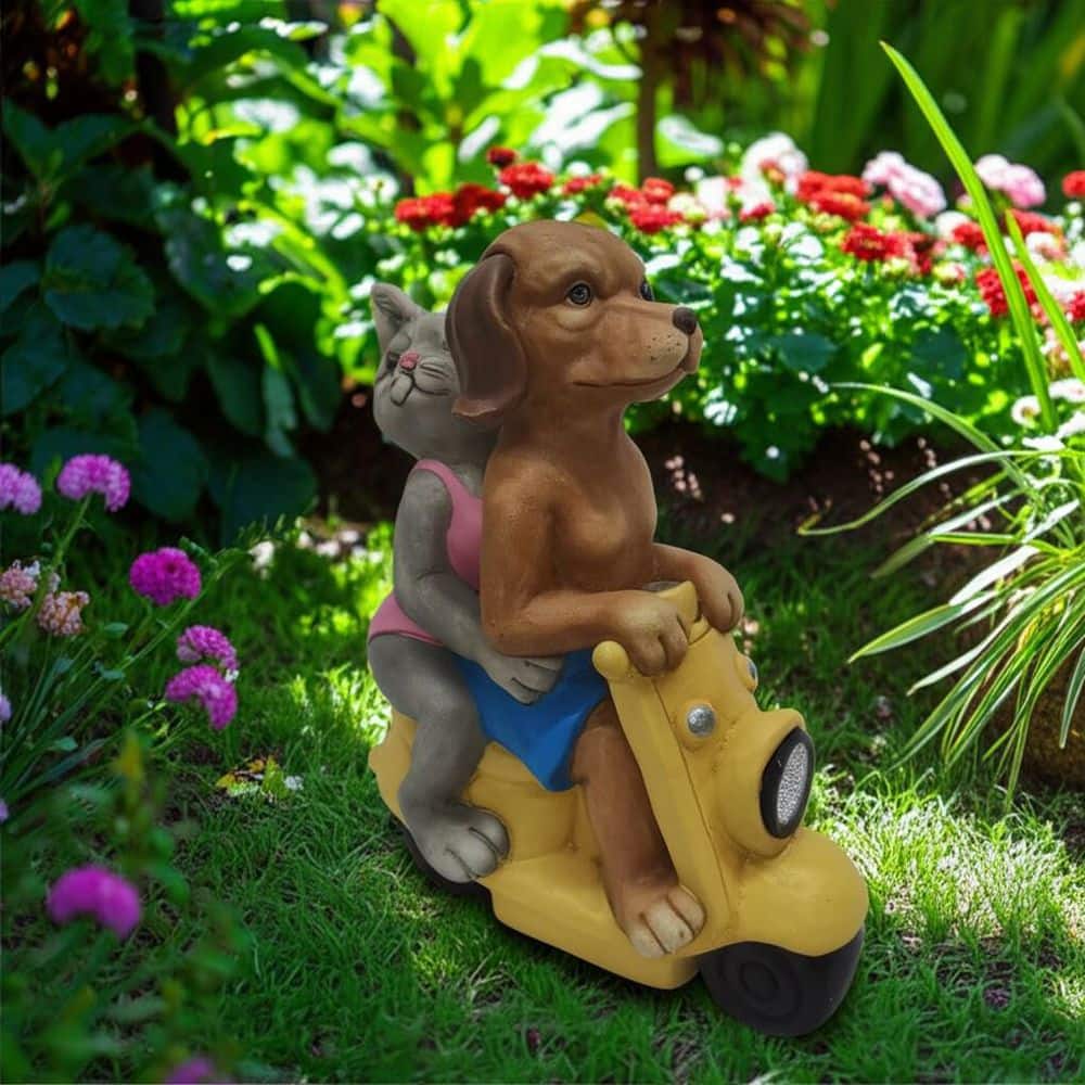 Liv & Skye 17 in. Yellow Resin Dog and Cat On Solar Scooter Garden
