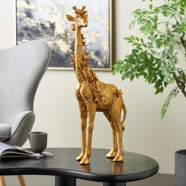 Litton Lane Gold Resin Standing Giraffe Sculpture with Textured Spots and Floral Accents