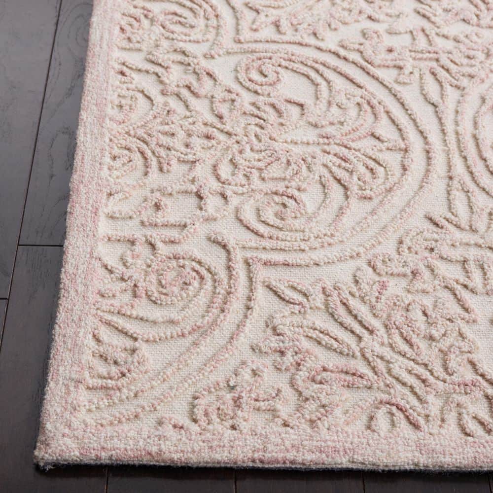 Ivory and Pink Hand Tufted Wool 6' x 9' Area Rug