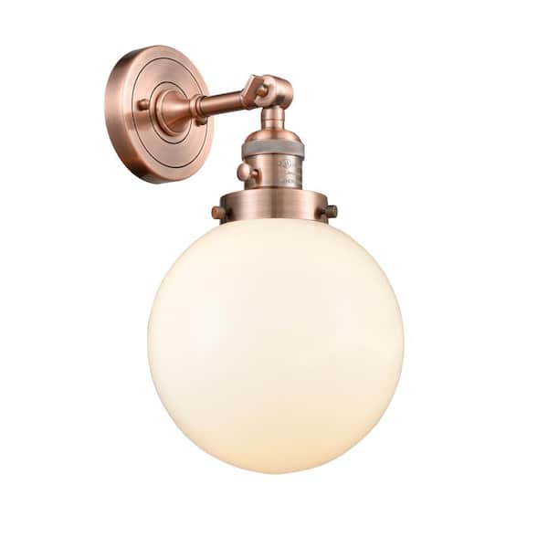Innovations Beacon 1-Light Matte White, Antique Copper Wall Sconce with White Glass Shade