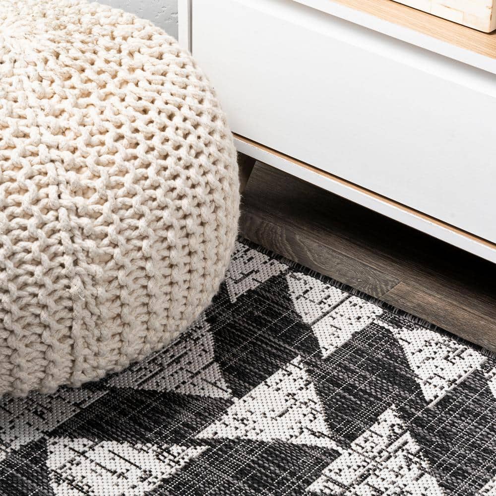 5' x 8' Black and Ivory Geometric Synthetic Area Rug