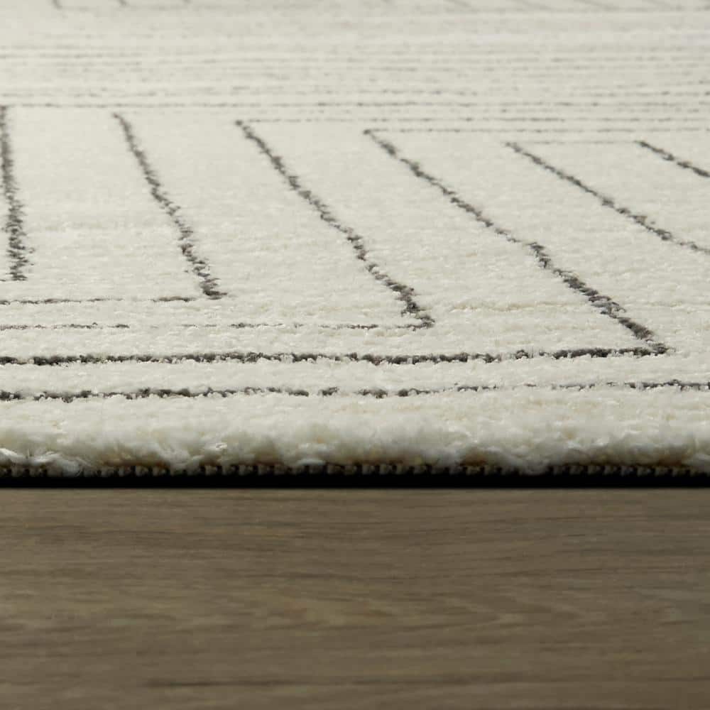 White Geometric Polyester and Polypropylene Area Rug