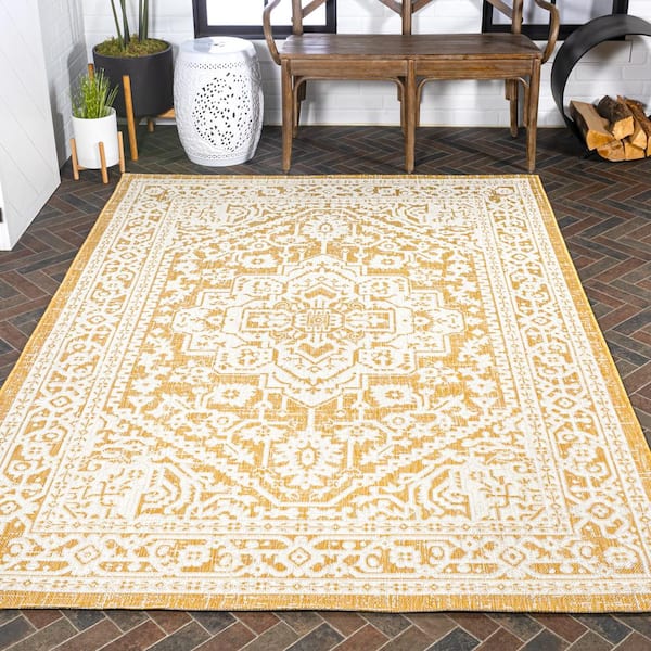 https://images.thdstatic.com/productImages/46cf66da-b454-455c-95ba-3d4923d90f9a/svn/yellow-cream-jonathan-y-outdoor-rugs-smb101i-8-1d_600.jpg