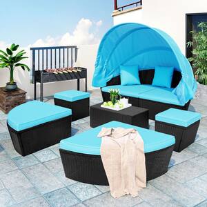 Black Wicker Outdoor Day Bed with Retractable Canopy and Blue Cushion