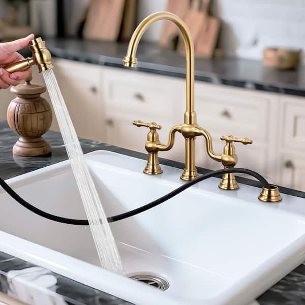 Double Handle High Arc Brass Bridge Kitchen Faucet with Side Sprayer in Brushed Gold