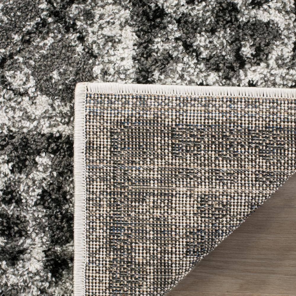 Ivory Geometric Easy-Care Synthetic 8' x 10' Area Rug