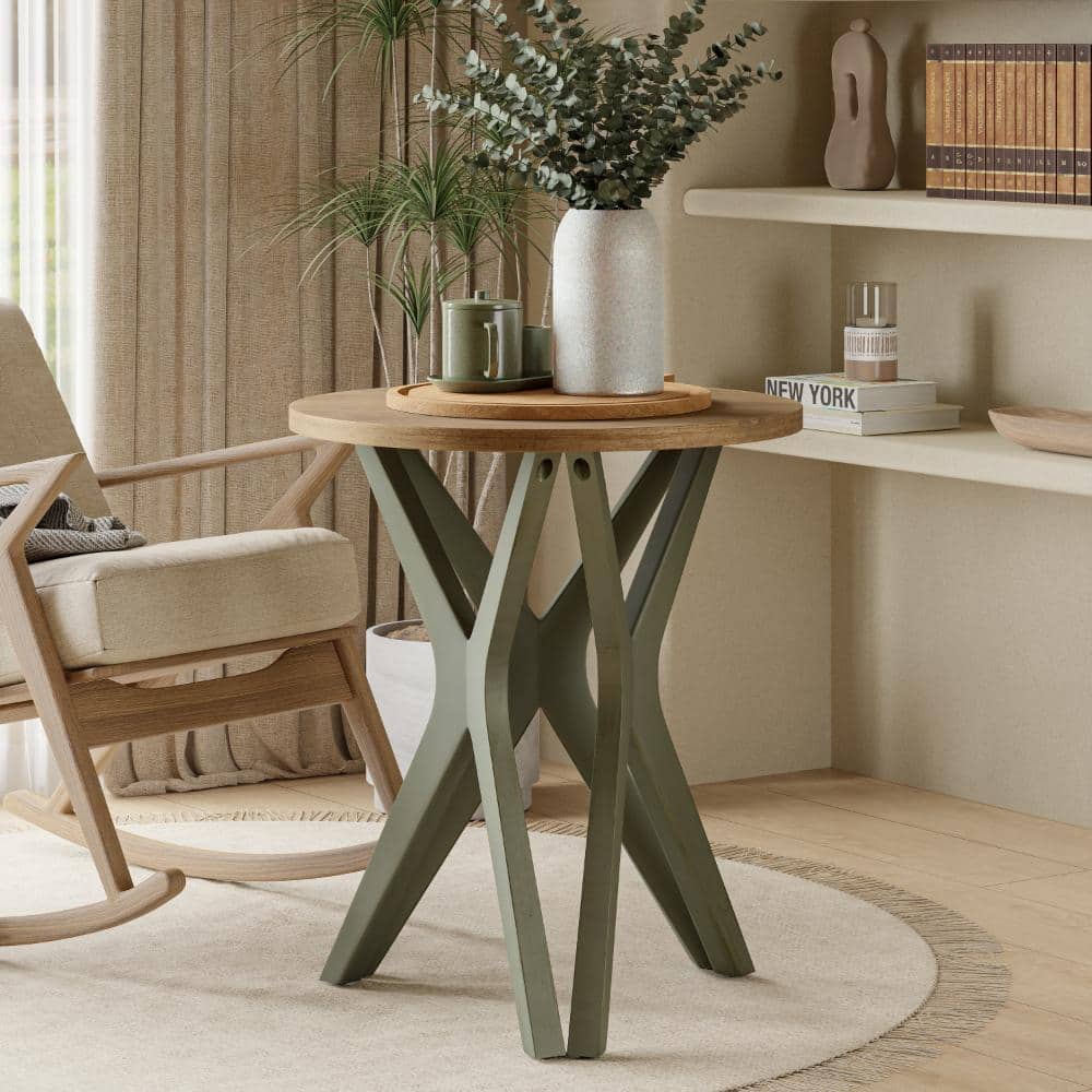 Green end table placed next to a wooden armchair in a living area.