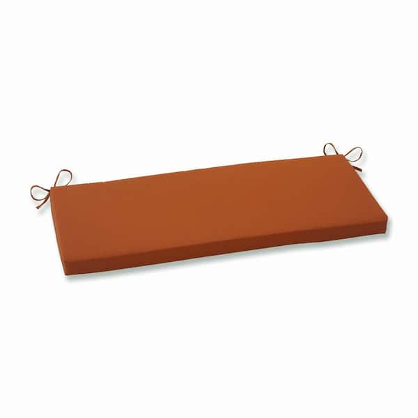 Pillow Perfect Solid Rectangular Outdoor Bench Cushion in Orange