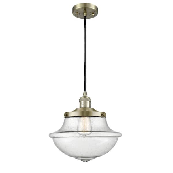 Innovations Oxford 1-Light Antique Brass Schoolhouse Pendant Light with Seedy Glass Shade