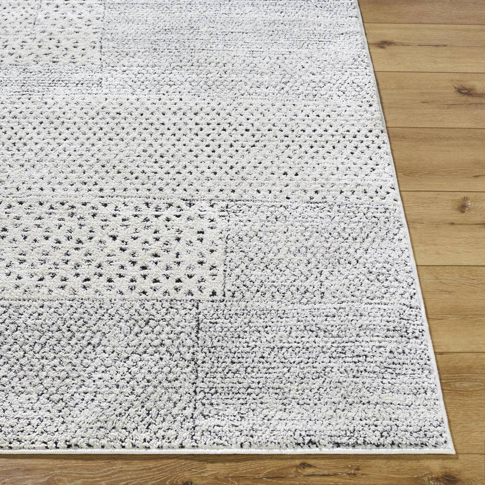 Livabliss 8' x 10' Ivory and Black Synthetic Patchwork Area Rug