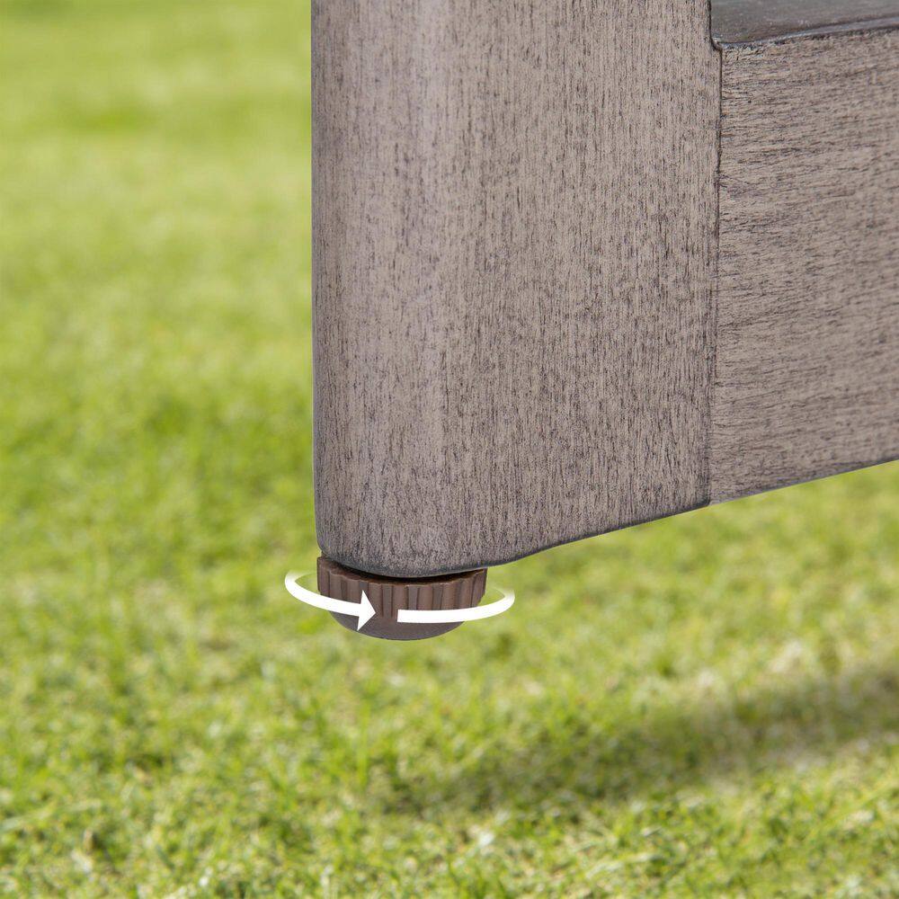 Close-up of the adjustable foot of the Sereno outdoor ottoman.