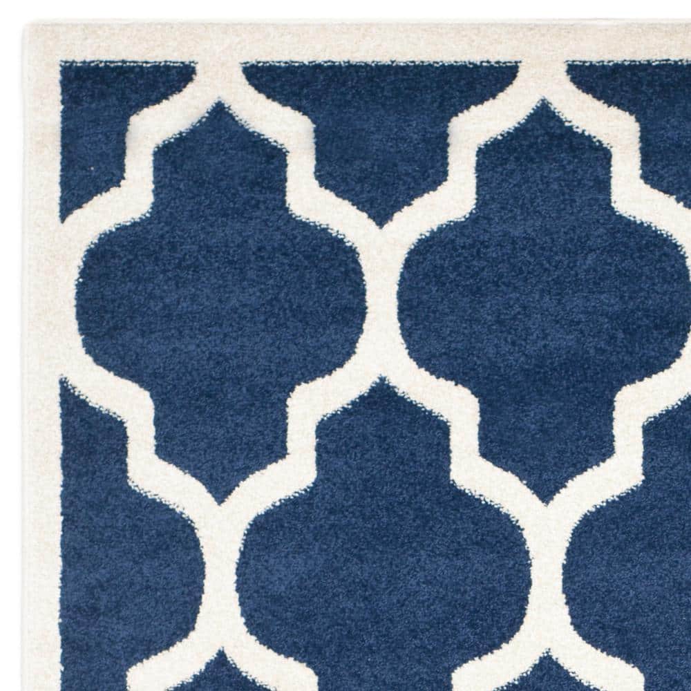 Reversible Geometric Navy and Beige 5' x 8' Synthetic Area Rug