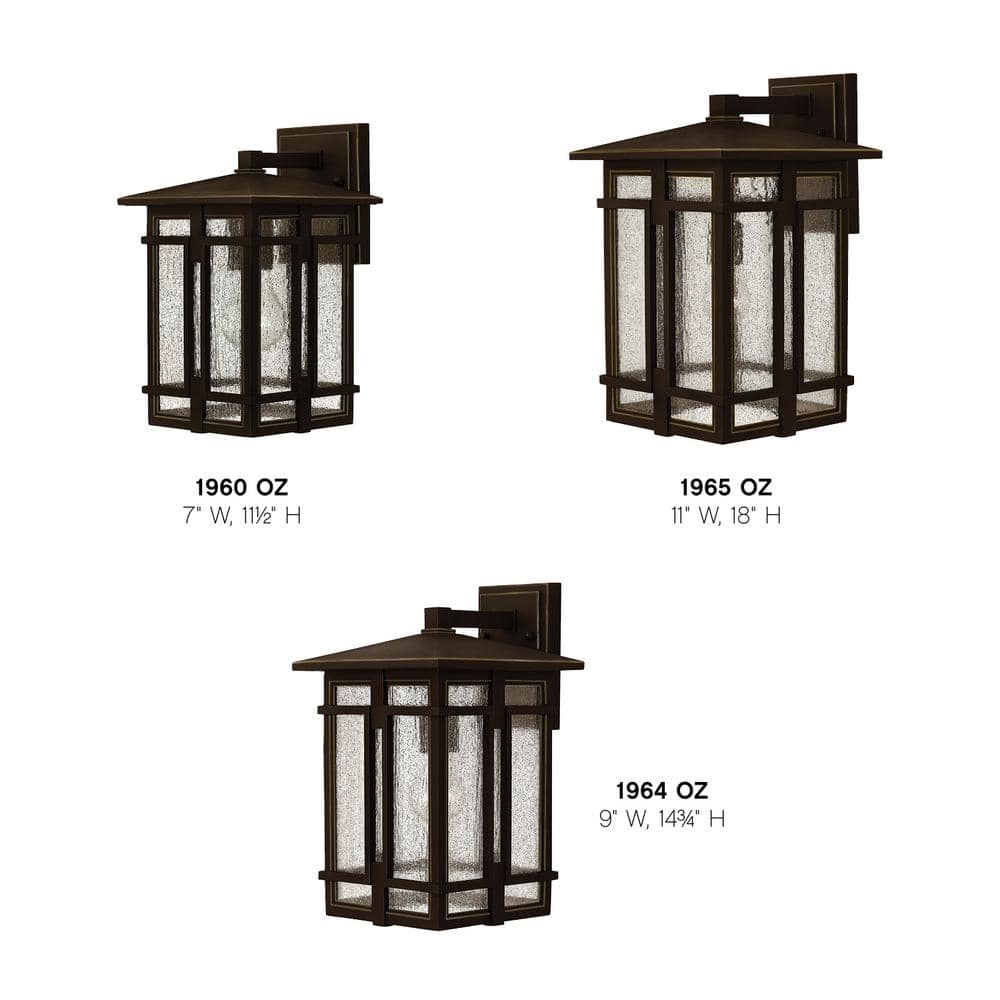 Elegant Bronze Outdoor Sconce with Clear Seedy Glass