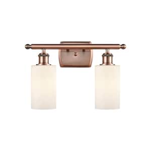 Clymer 16 in. 2-Light Antique Copper Vanity Light with Matte White Glass Shade