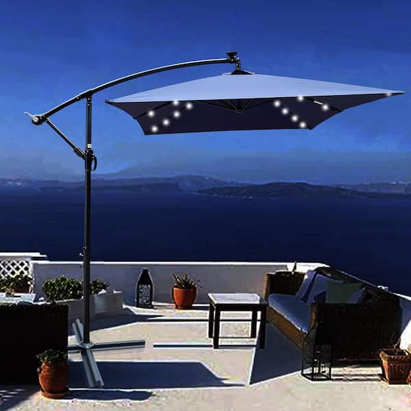 10 ft. x 6.5 ft. Steel Cantilever Solar Patio Umbrella in Navy Blue with 26 Solar LED Lights and Cross Base Stand