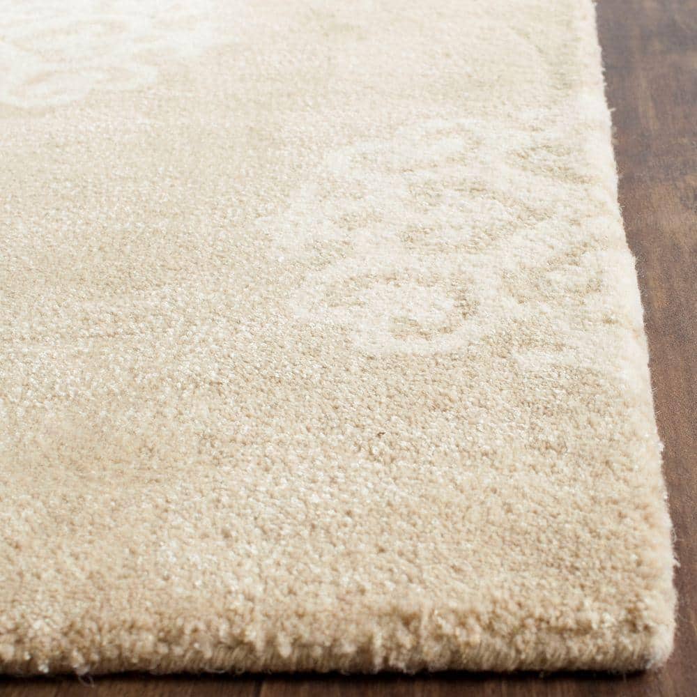 Beige and Ivory 6' x 9' Hand-Tufted Wool and Viscose Area Rug