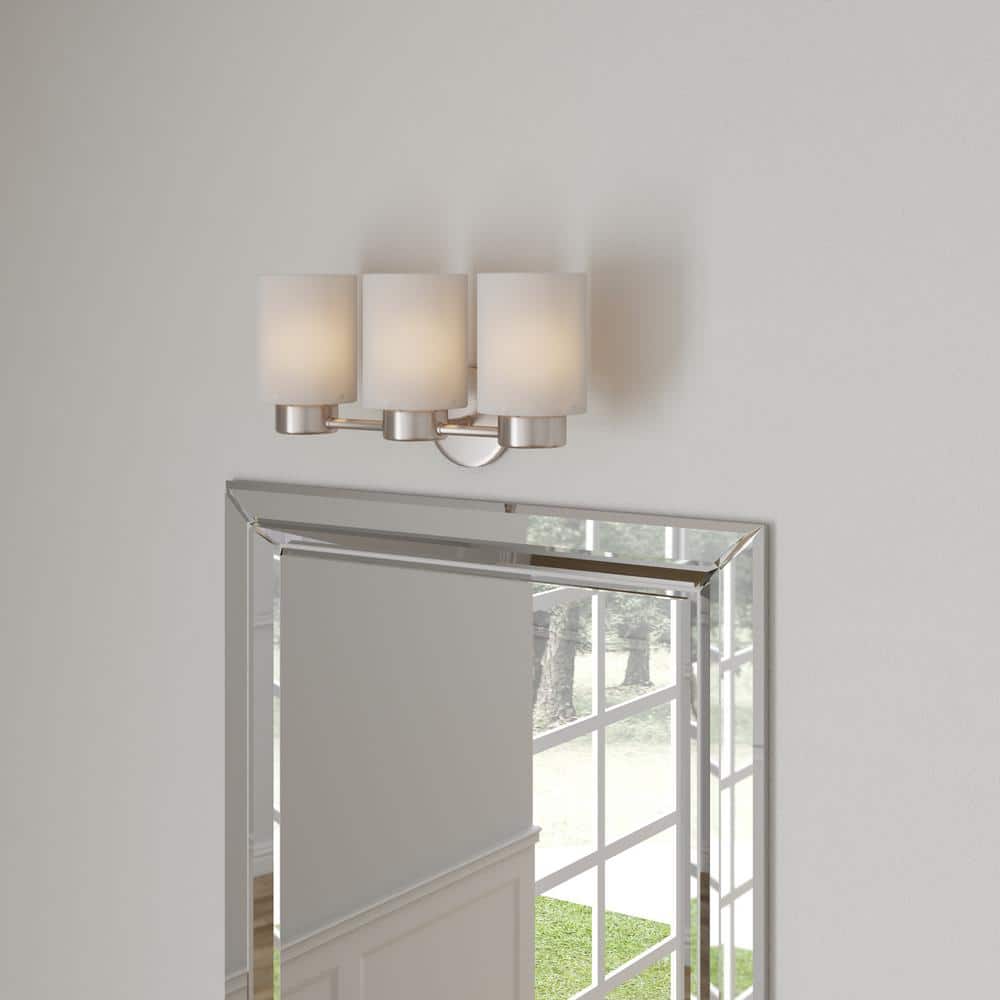 Elegant Brushed Nickel 3-Light Wall Sconce with Frosted Seeded Glass