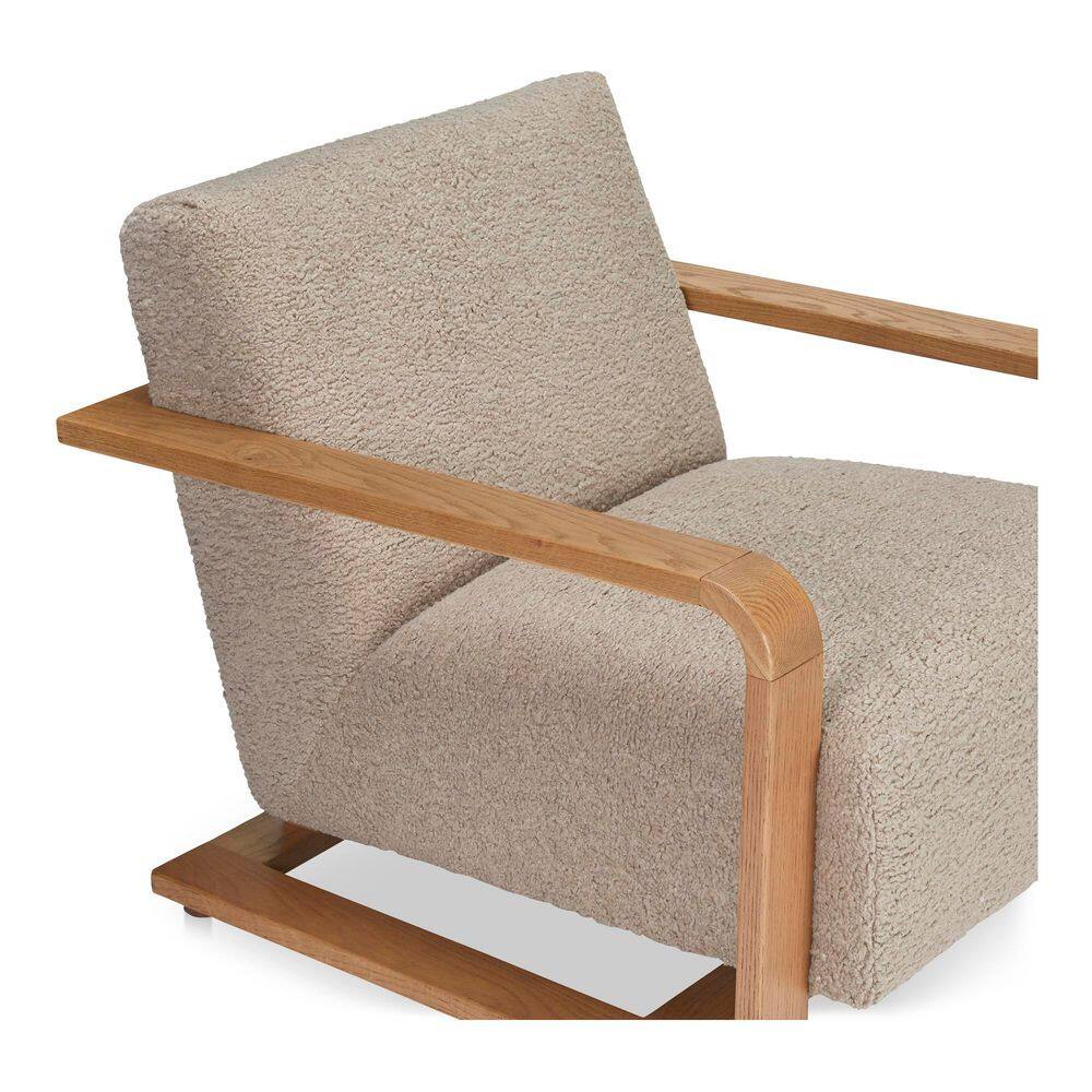 Side profile of a beige faux shearling chair.